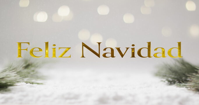 Feliz navidad text in gold over christmas tree sprigs, snow and bokeh lights on grey background