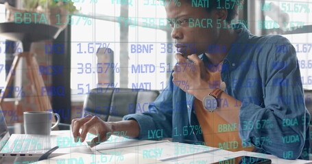 Image of data processing over african american businessman in office