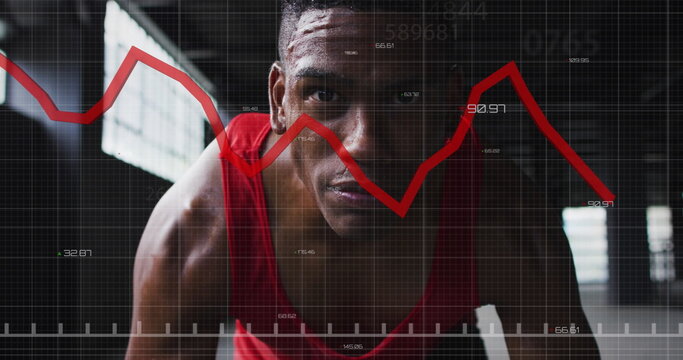 Image of graphs and statistics over man exercising in an abandoned building