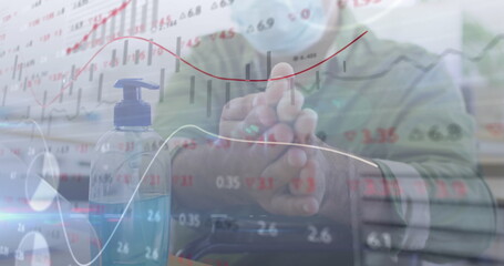 Image of digital interface showing statistics with man disinfecting hands in office
