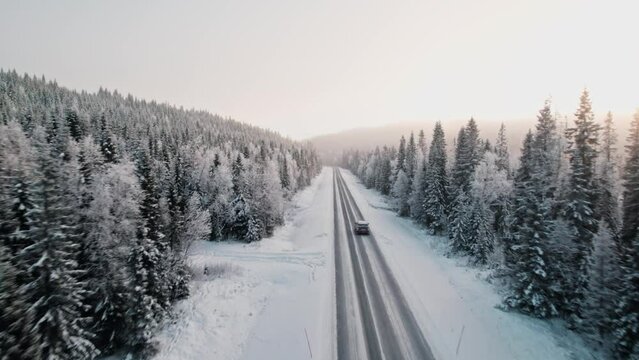 Long snowy an icy road in northern Sweden, middle of winter, winter wonderland.
