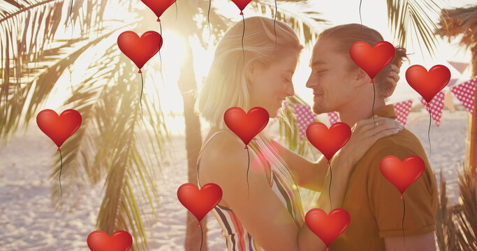 Image of heart icons over couple in love on beach