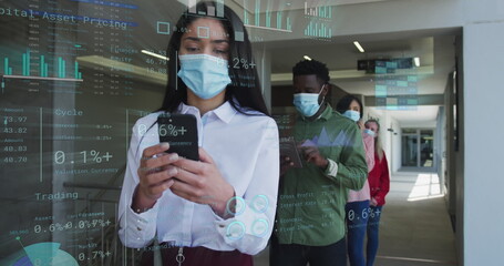 Image of financial data over diverse business people in face masks queueing in corridor