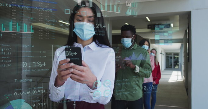 Image of financial data over diverse business people in face masks queueing in corridor