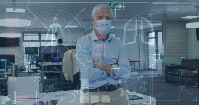 Image of digital interface showing medical data with colleagues in office wearing face masks - Powered by Adobe