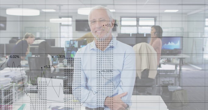 Image of digital interface showing statistics with diverse colleagues working together in an office