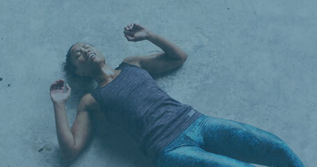 Image of spinning shapes over woman doing push ups