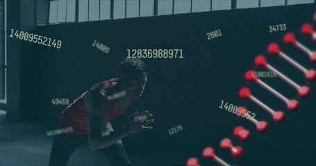 Image of dna strain spinning over man jogging in an abandoned building