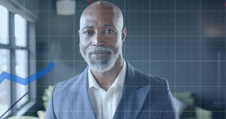 Image of financial data processing over african american businessman in office