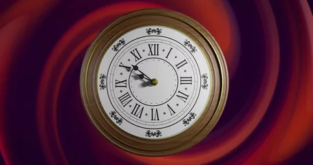  Image of clock ticking over red swirls background © vectorfusionart