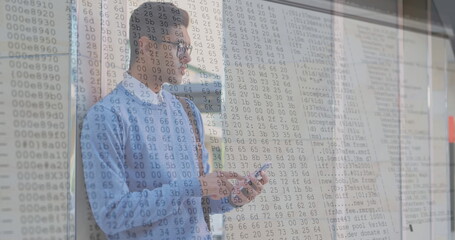 Image of numbers changing and data processing on computer screens over man using smartphone