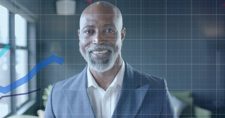 Image of financial data processing over african american businessman in office