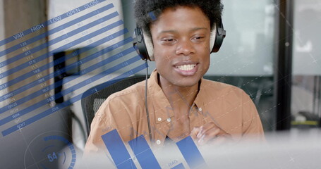 Image of data processing over african american businessman in office