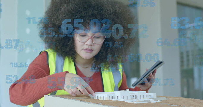Image of statistics and data processing over biracial female architect in office