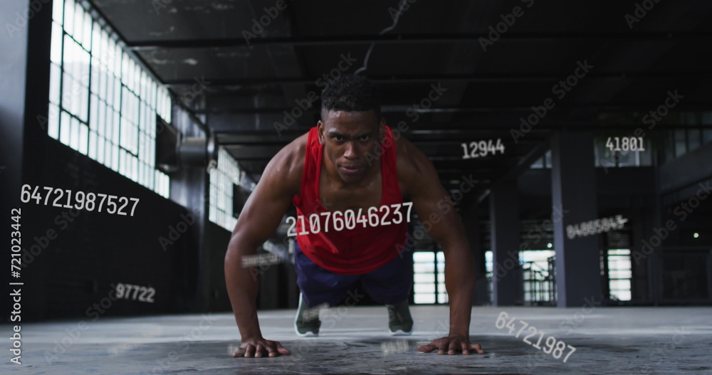Poster image of falling numbers over man doing push ups in an abandoned building