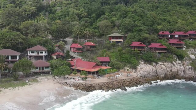 Aerial View Of Villas Beside Aow Leuk Beach. Slow Parallax Shot