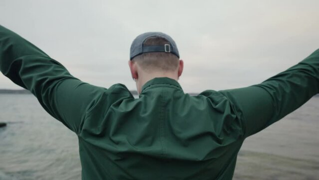 Runner prepares for a dawn run by the lakeside early in the morning.