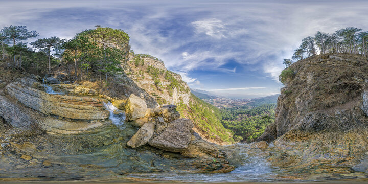 Wide panoramic view on mountain landscape with lush green hills under clear blue sky, tranquil natural beauty, perfect for outdoor enthusiasts. Seamless 360 degree spherical equirectangular panorama.