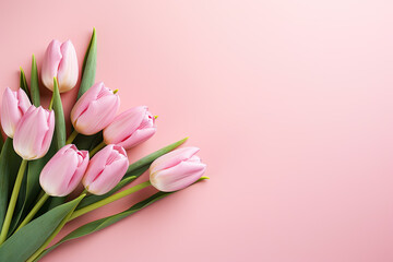 Beautiful composition spring flowers. Bouquet of pink tulips flowers on pastel pink background. Valentine's Day, Easter, Birthday, Happy Women's Day, Mother's Day. Flat lay, top view, copy space