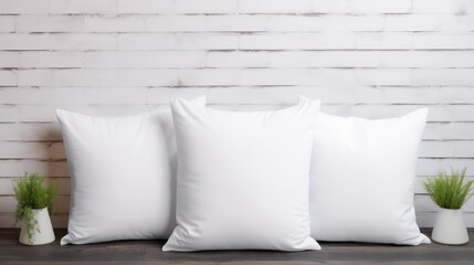 White pillows mockup on a wooden table in front of a white brick wall