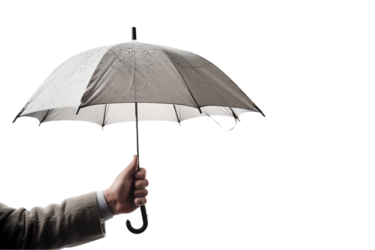 Isolated hand protects with an open umbrella in rainy weather, illustrating the concept of shelter and security
