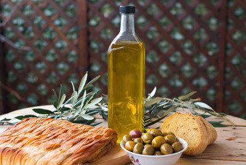 olive oil, extra virgin olive oil in a glass bottle, on a wooden table.