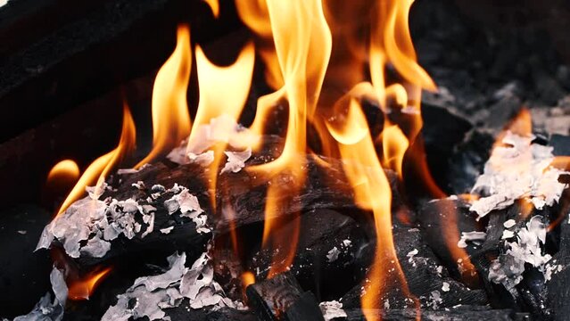 Slow motion burning fire flame, closeup night bonfire, fireplace, campfire, bbq