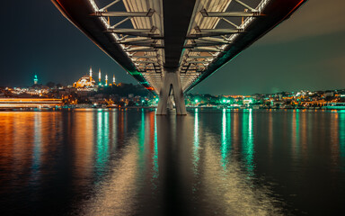 under the bridge over bosphorus at night