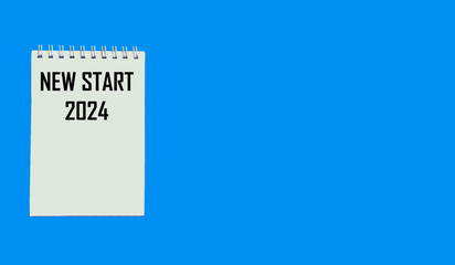 Sheet of white paper with the text NEW START 2024 on a blue background