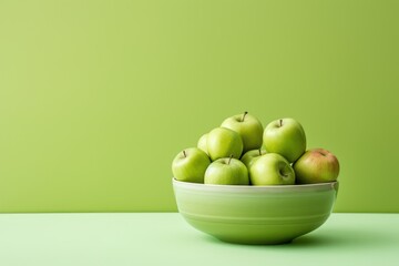 Fresh Green Apples in a Bowl on a Green Background AI Generated