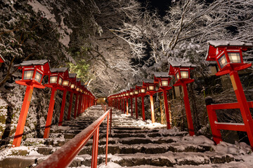 Kifune shrine stone stairs and traditional light pole in snowy winter night, Kyoto, Japan. - obrazy, fototapety, plakaty