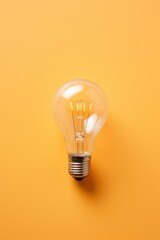 Overhead View of a Light Bulb on a Light Colored Background AI Generated