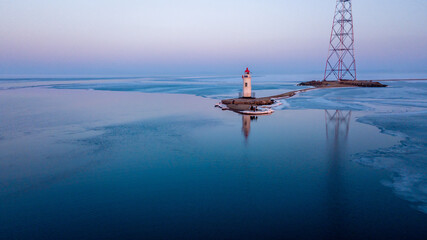 View from above. Winter Vladivostok. Tokarevsky lighthouse at dawn.