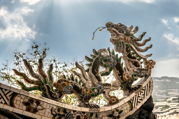 Dragon Mosaic Sculpture Adorning Pagoda Temple Rooftop, Architectural Elegance and Cultural...