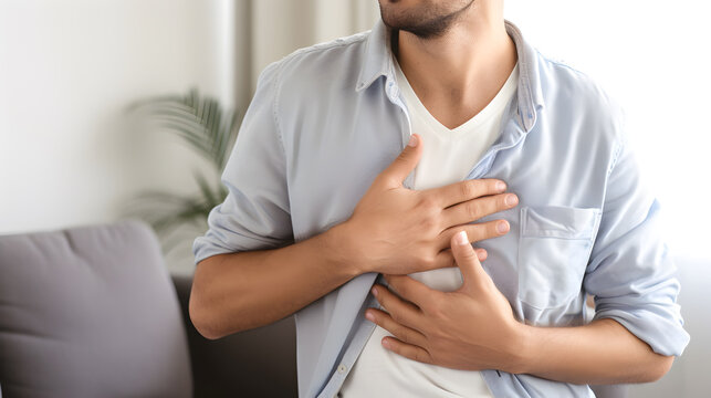 Young man with chest pain. Heart attack patient.