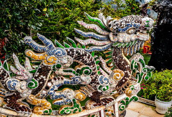 Dragon Mosaic Sculpture Adorning Pagoda Temple Rooftop, Architectural Elegance and Cultural...