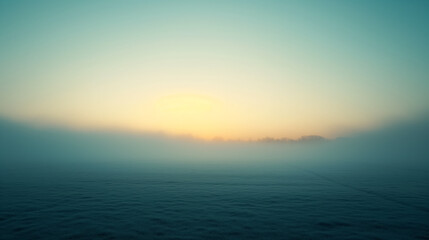 Obraz premium Tranquil sunrise over a misty, open field.