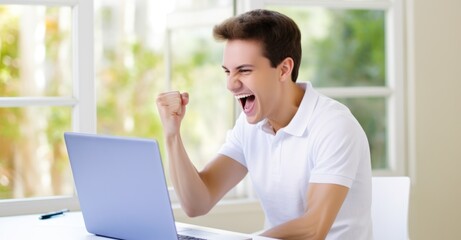 Fototapeta premium a man cheers in front of a laptop