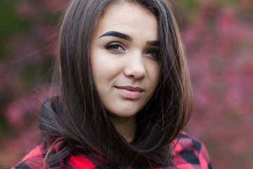 Fototapeta premium Beautiful girl with shiny black hair and black eyes. Miss from Ukraine