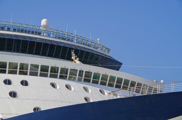 Fototapeta premium Cruiseship cruise ship liner Infinity in port with harbor infrastructure moored to pier