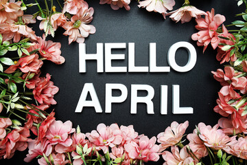 Hello April alphabet letter with flower decoration on black background