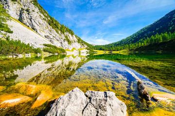 Schwarzensee on the high plateau of the Tauplitzalm. View of the lake at the Totes Gebirge in Styria. Idyllic landscape with mountains and a lake on the Tauplitz in Austria.
