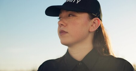 Security guard, woman and outdoor working in safety, protection and surveillance of property. Serious, person and professional bodyguard monitoring real estate on street in city with crime awareness