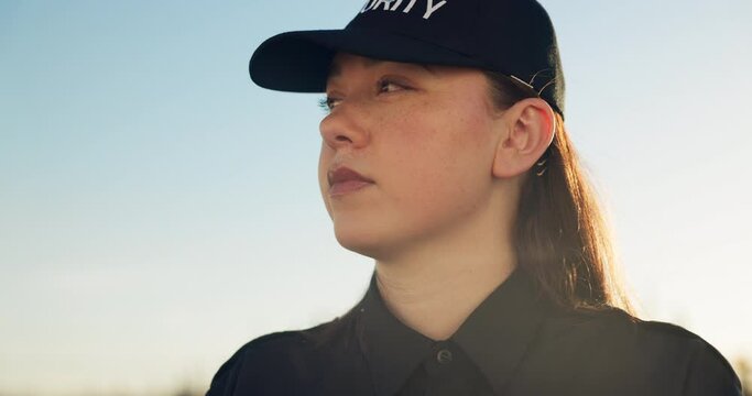 Security guard, woman and outdoor working in safety, protection and surveillance of property. Serious, person and professional bodyguard monitoring real estate on street in city with crime awareness