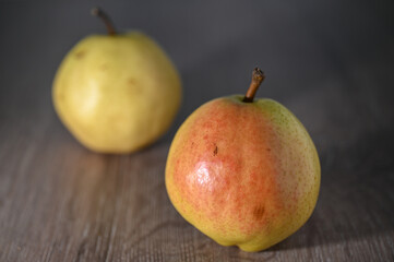 two juicy pears on a wooden table, studio shooting 2
