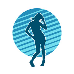 Silhouette of a slim female in dance pose. Silhouette of a woman dancing.