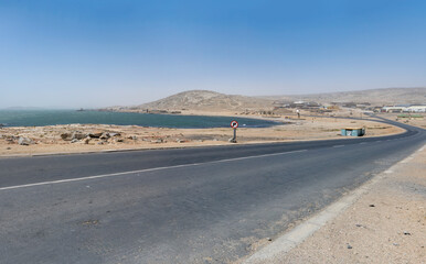 road on shore and Agate beach at historical town, Luderitz,  Namibia