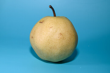juicy pear on a green background studio shooting 2