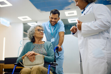 Smiling senior woman in wheelchair during visit at doctor's office.