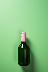 mockup. green glass bottle with pink cork on light green background.